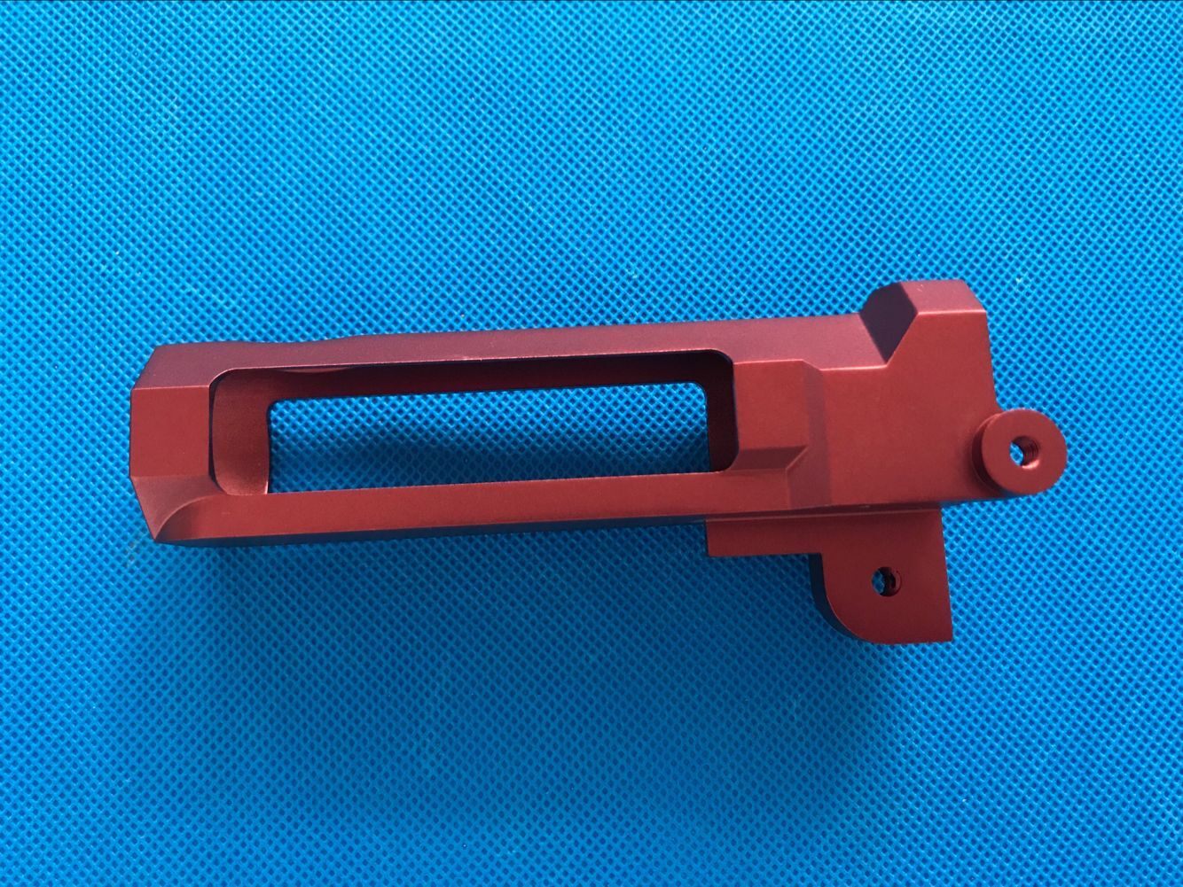 Red anodized CNC-machined aluminum component